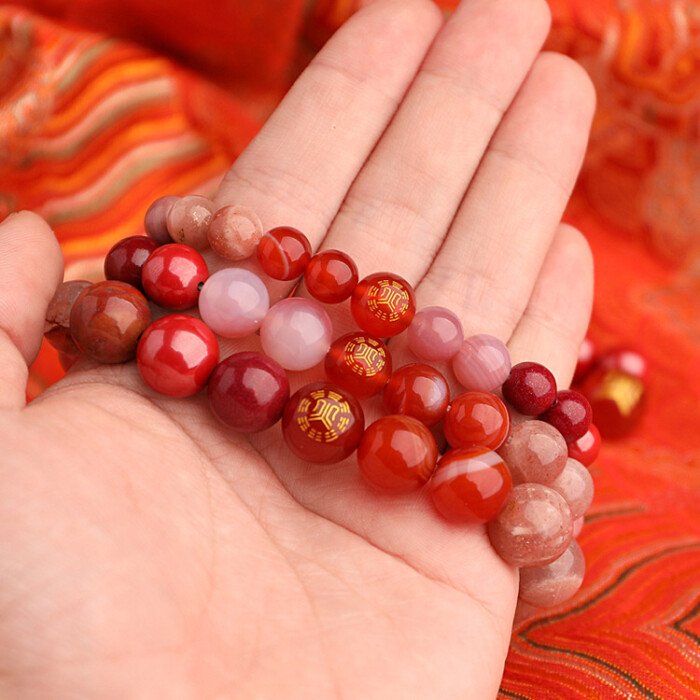 The five-element “fire-supplementing” crystal bracelet with red agate and cinnabar for balancing the fire element.