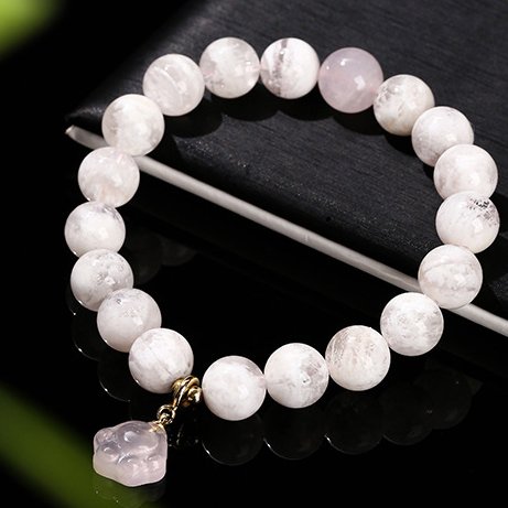 Snowflake phantom crystal round bead bracelet with rose quartz cat claw accessories. - taoistcrystal.com Snowflake phantom crystal round bead bracelet with rose quartz cat claw accessories.