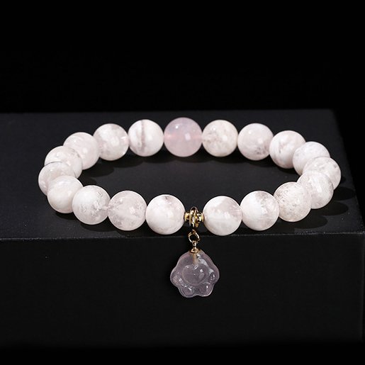 Snowflake phantom crystal round bead bracelet with rose quartz cat claw accessories.
