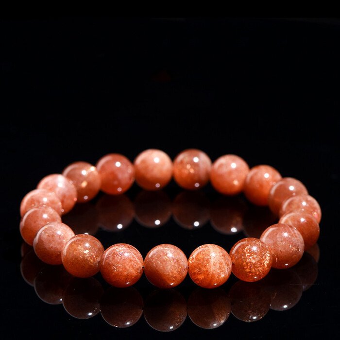 Golden sunstone round bead bracelet for increasing self-confidence.