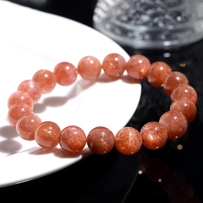 Golden sunstone round bead bracelet for increasing self-confidence.