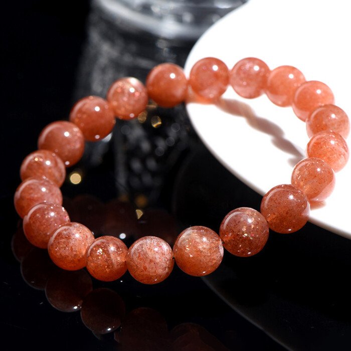 Golden sunstone round bead bracelet for increasing self-confidence.