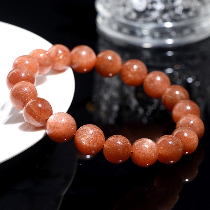 Golden sunstone round bead bracelet for increasing self-confidence.