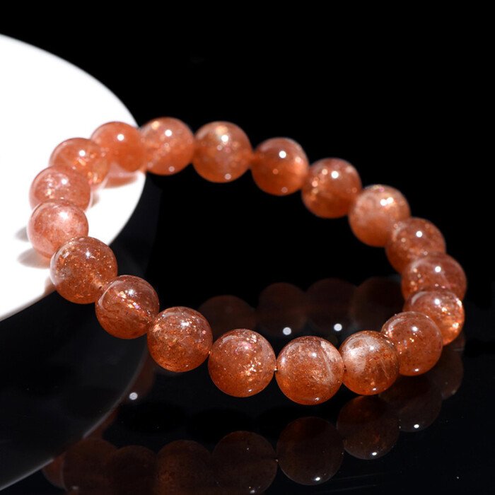 Golden sunstone round bead bracelet for increasing self-confidence.