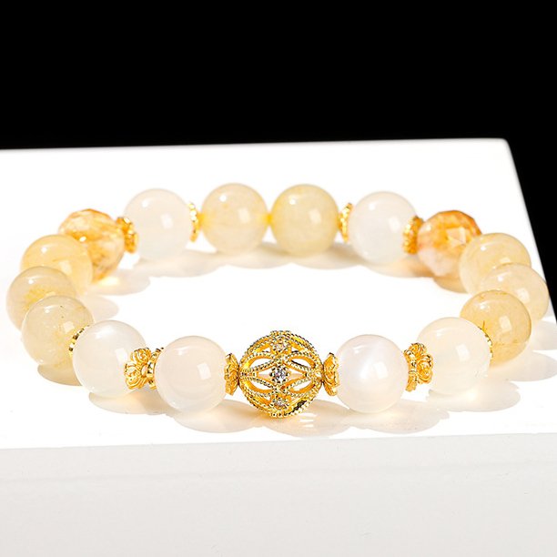 Natural cottony golden rutilated quartz and yellow moonstone transfer bead bracelet.