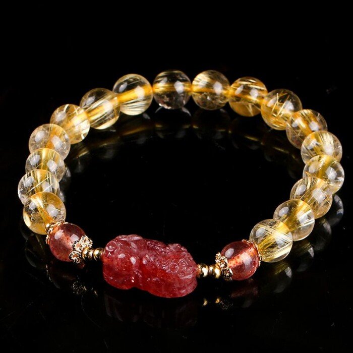 Golden rutilated quartz and strawberry quartz pixiu elastic rope bracelet.