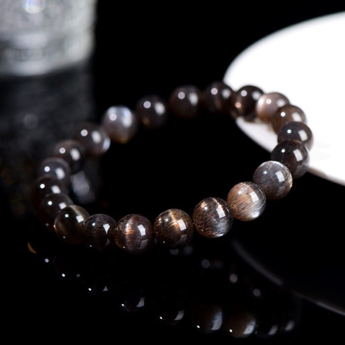 Black gold skeletal round bead crystal single-loop bracelet.