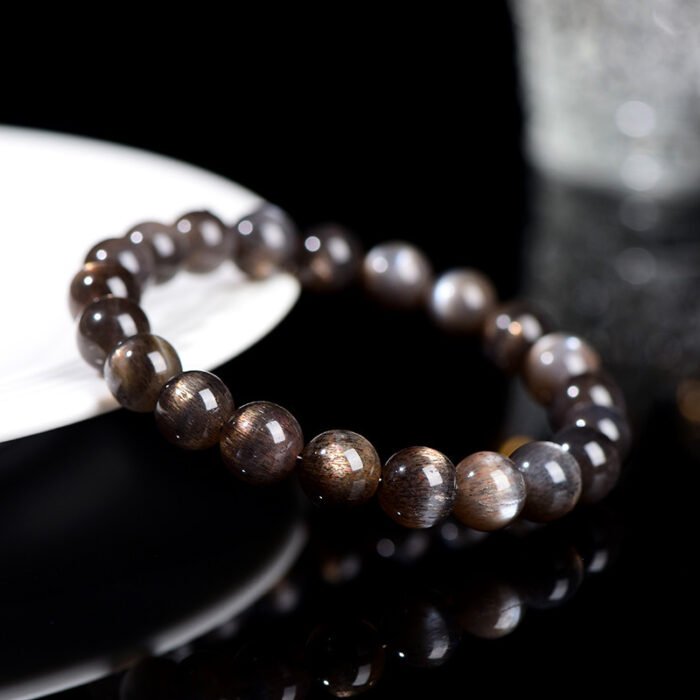 Black gold skeletal round bead crystal single-loop bracelet.