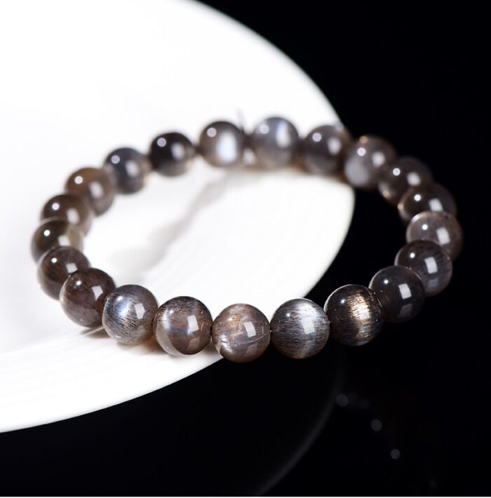 Black gold skeletal round bead crystal single-loop bracelet.