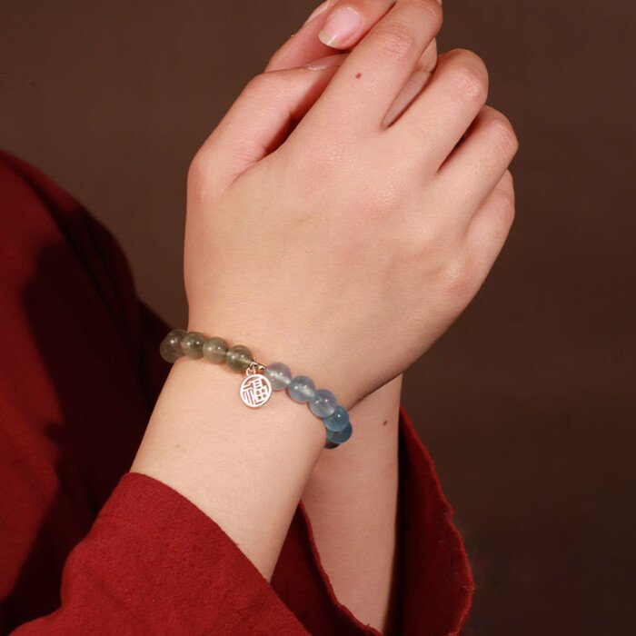 Crystal “Fu” – shaped charm bracelet for supplementing water & wood elements in the Wuxing theory