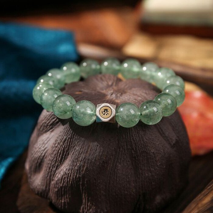 Natural green strawberry quartz hand string with zodiac signs of Rabbit, Dragon, and Horse, and figures of Samantabhadra, Mahasthamaprapta, and Manjushri.