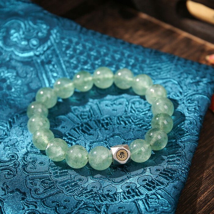Natural green strawberry quartz hand string with zodiac signs of Rabbit, Dragon, and Horse, and figures of Samantabhadra, Mahasthamaprapta, and Manjushri.