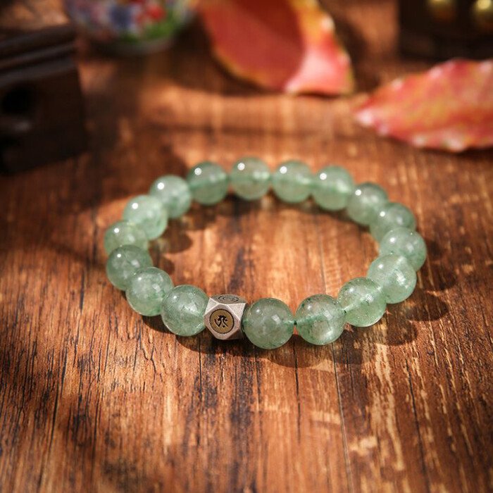 Natural green strawberry quartz hand string with zodiac signs of Rabbit, Dragon, and Horse, and figures of Samantabhadra, Mahasthamaprapta, and Manjushri.