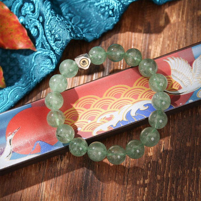 Natural green strawberry quartz hand string with zodiac signs of Rabbit, Dragon, and Horse, and figures of Samantabhadra, Mahasthamaprapta, and Manjushri.